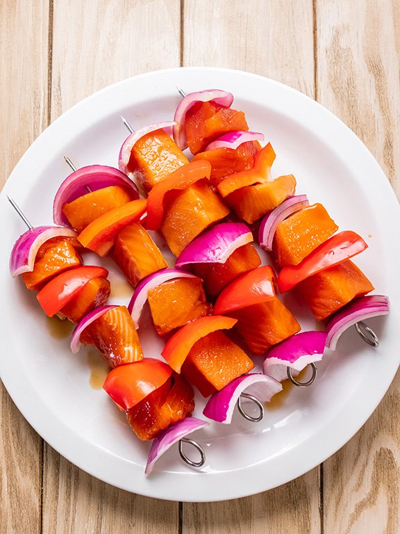 Image of Thread salmon onto 8-inch skewers alternating with bell pepper and...