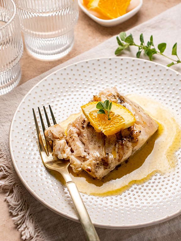 Image of Serve hot drizzled with citrus butter sauce. 