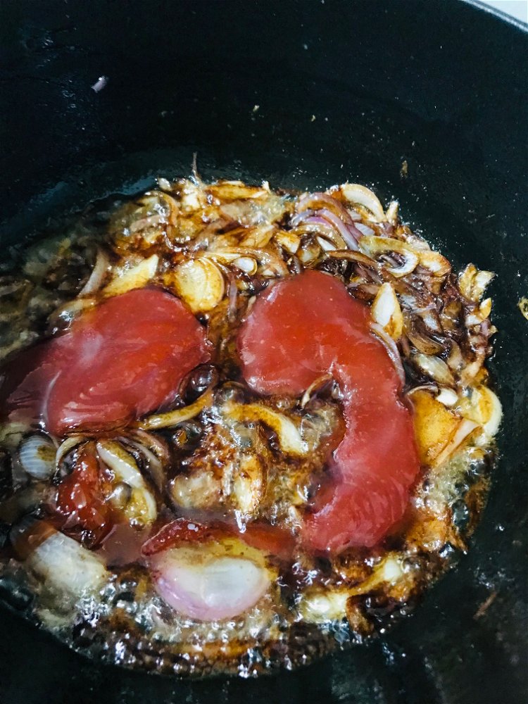 Image of Add chilli sauce and beef broth. Let it simmer for...