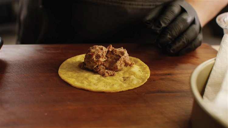 Image of Place two tablespoons of the filling on each tortilla. Form...