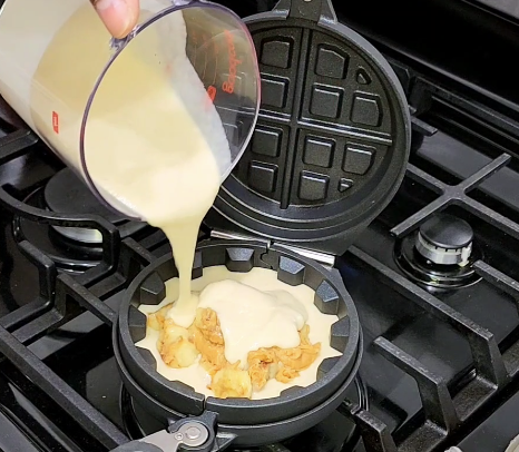 Image of Proceed to cover the filling with the waffle batter and...