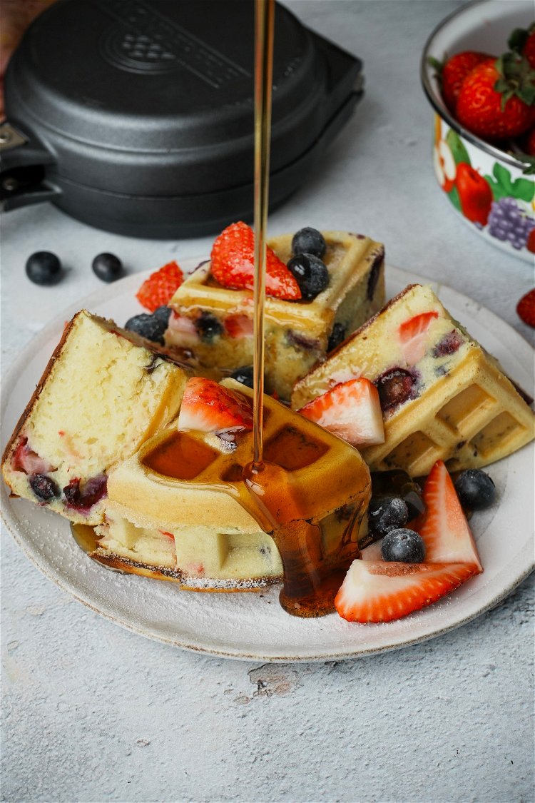 Image of Serve with more fruit on top and powdered sugar.