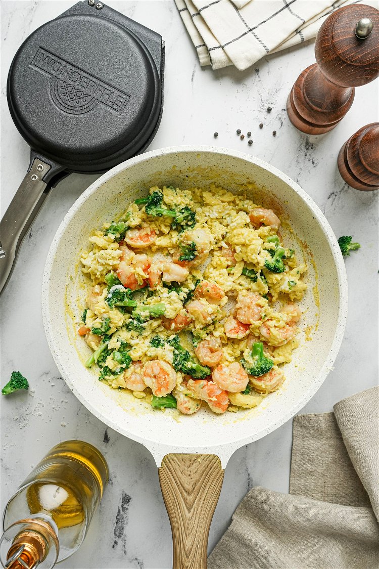 Image of Pour the beaten eggs over the shrimp and broccoli and...