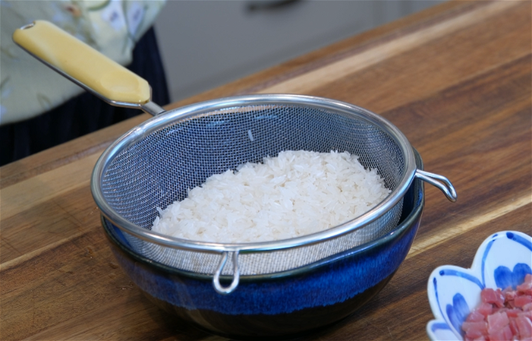 Image of Wash the rice several times to remove the impurities and...