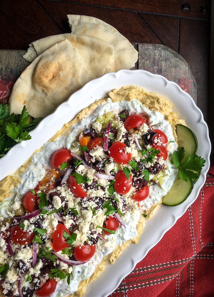 Image of Add the Kalamata olives, followed by the crumbled Feta and...