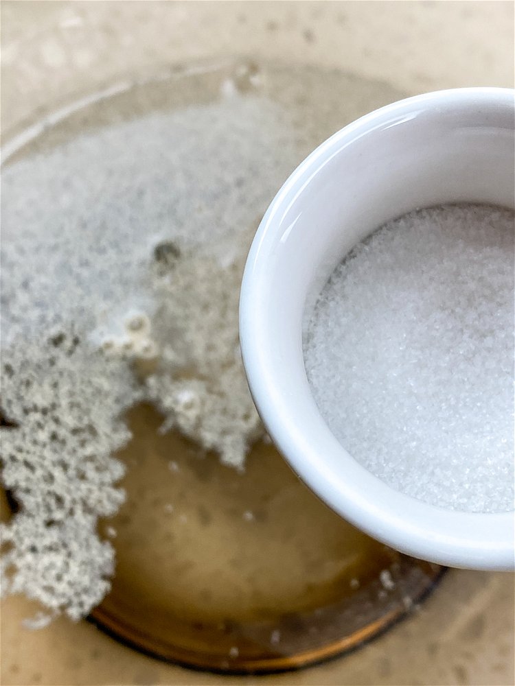 Image of To proof the yeast, add the warm water to a...