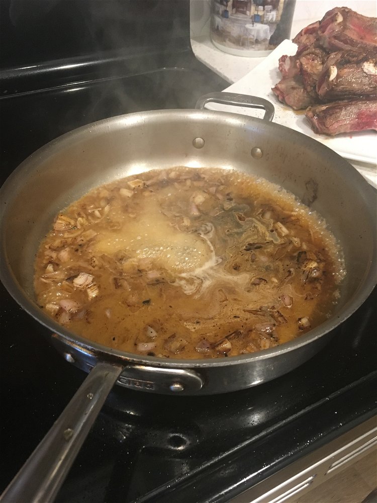 Image of Deglaze the skillet by pouring in the beef broth and...