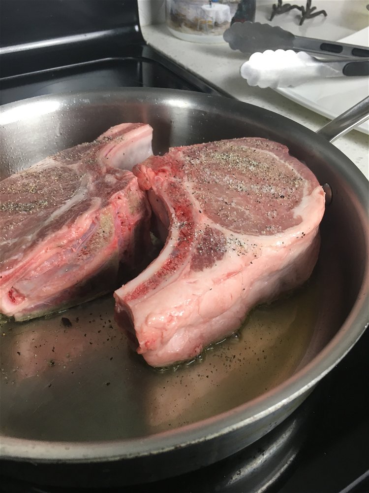 Image of Season the chops with salt and black pepper on both...