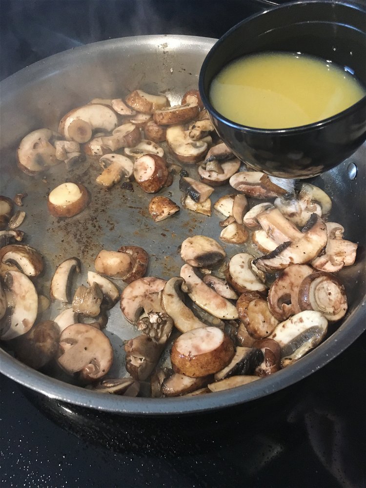 Image of Add the sliced Portobello mushrooms to the skillet and season...
