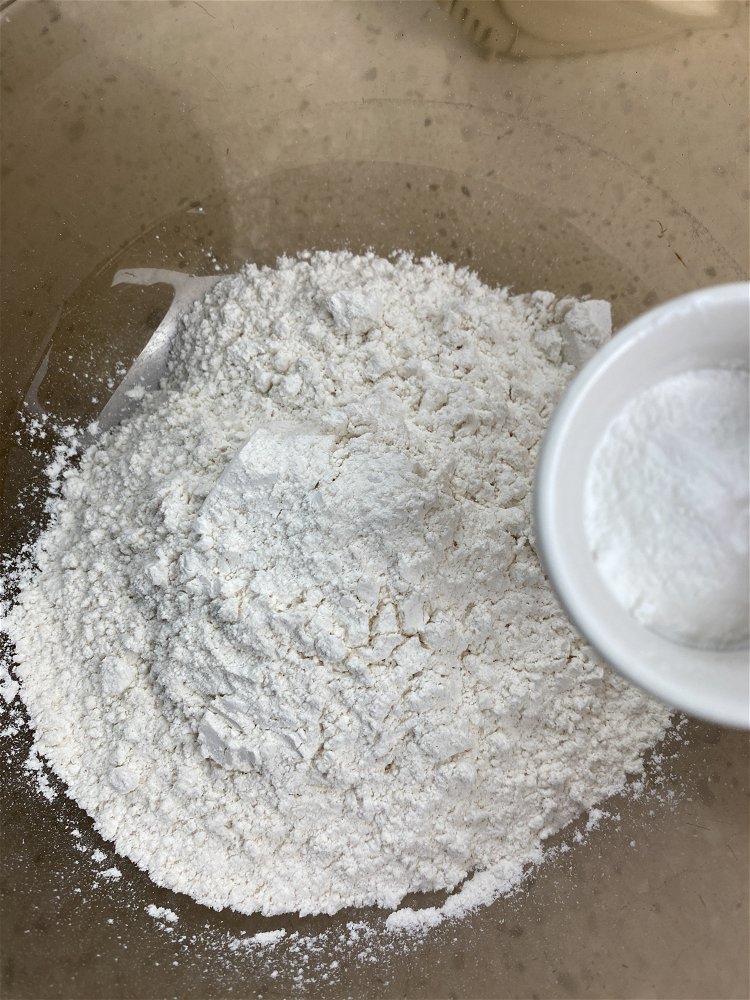 Image of Combine the flour, baking soda, and salt in a large...