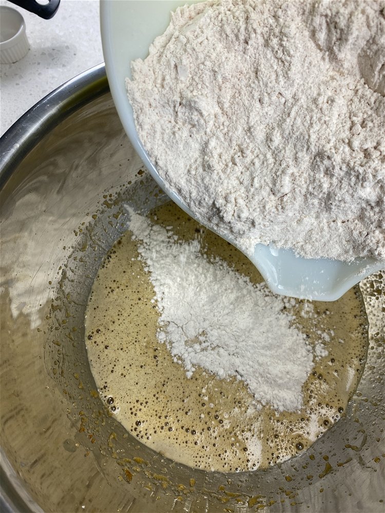 Image of Pour the dry ingredients into the wet, a little at...