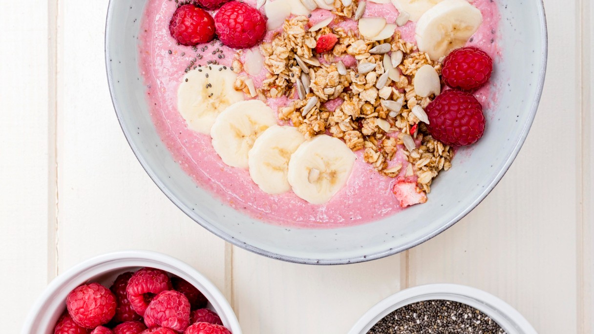 Image of Granola with coconut yoghurt, raspberries and chia seeds
