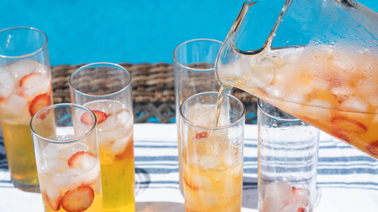 Image of Raise your glass and savor the delightful medley of zesty lemon, succulent strawberries, and smooth Wheatley vodka. With its invigorating flavors and eye-catching aesthetics, this Strawberry Lemonade pitcher is the ultimate companion for picnics, BBQs, and outdoor gatherings.