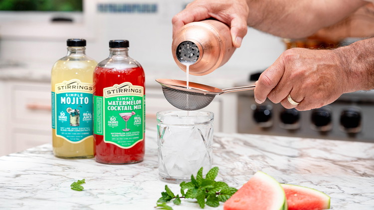 Image of Shake to blend all the flavors and ingredients together, and strain into your glass filled with crushed ice. The result should be a balanced symphony of sweet watermelon, invigorating mint, and the subtle richness of coconut.