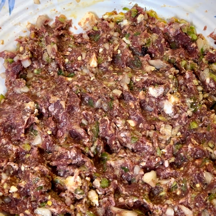 Image of Mix all ingredients together until they're evenly mixed and distributed. Then form your meatballs. 