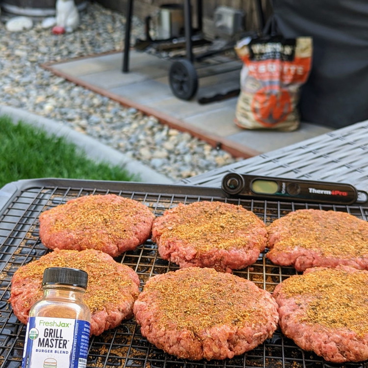 Image of Form the ground beef into about 1/3 lb patties and season both sides liberally with FreshJax Grill Master Burger Blend.