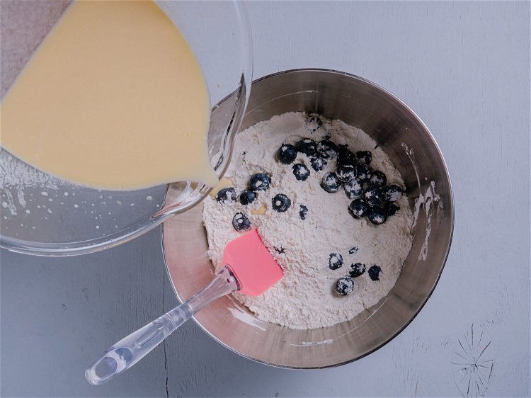 Image of Pour the liquid ingredients into the dry and gently fold...