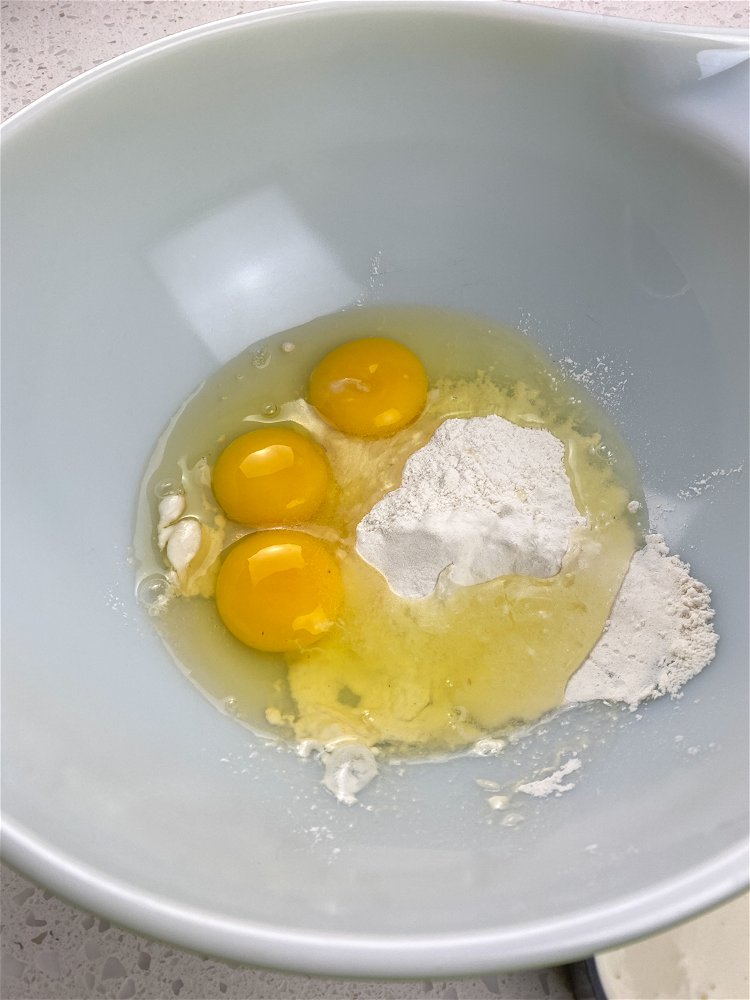 Image of Combine the flour, eggs, milk, cinnamon, vanilla, sugar, and salt...