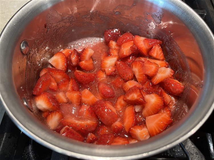 Image of In a small saucepan, cook strawberries and sugar on medium...