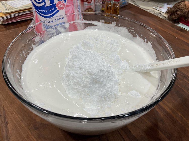 Image of Add powdered sugar slowly. This will be sticky at first,...