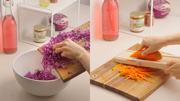 Image of While the noodles soak, prepare the vegetables. Chop the carrots, cabbage, mango, cucumber, cilantro, and green onion to your desired size. 
