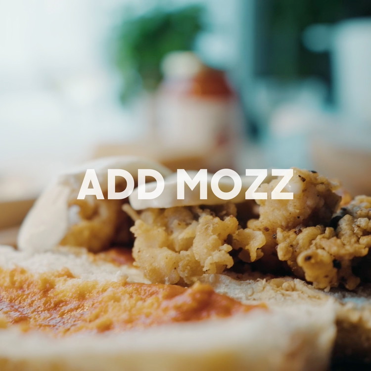 Image of Place Lobster Tail on bread and cover with Fresh Mozzarella, on the opposite side add Monte’s Sauce.