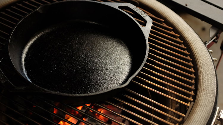 Image of Place a Lodge 10” Cast Iron Skillet in the grill...
