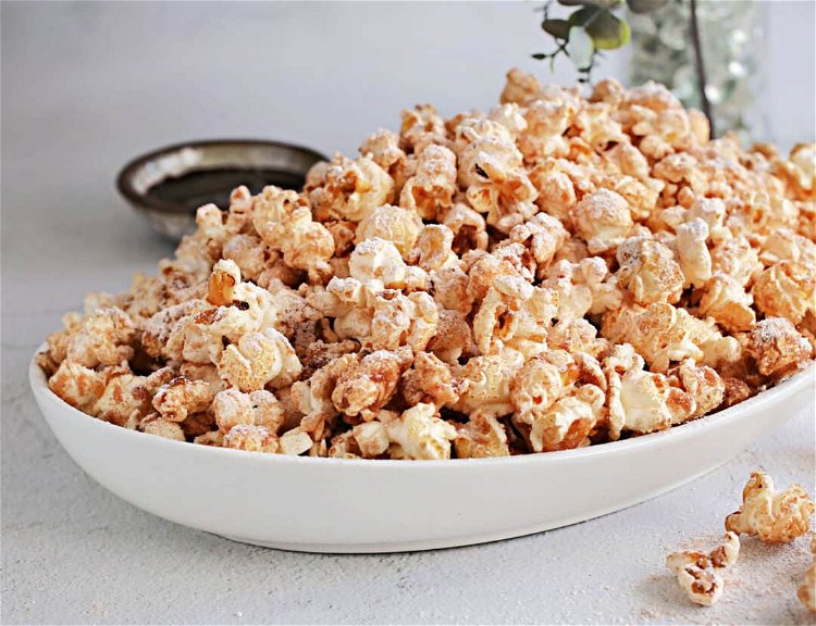 Image of Add in the popped popcorn and stir until fully coated.