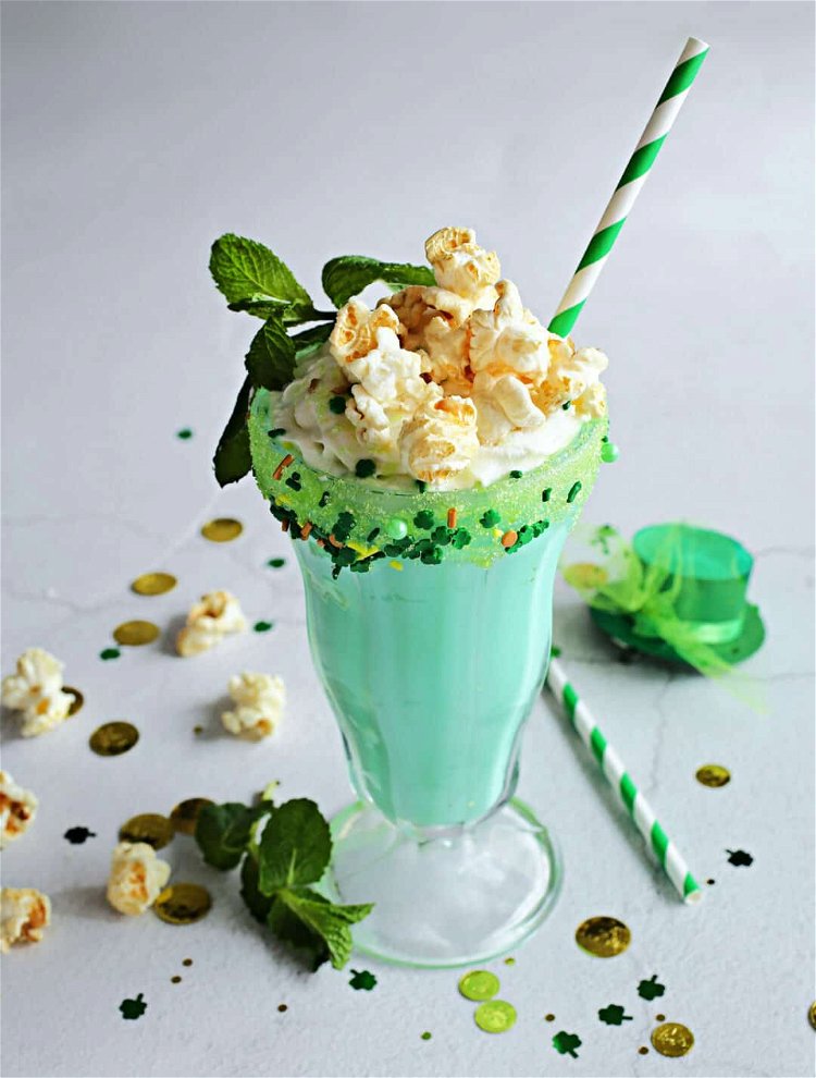 Image of To make the shake, add the vanilla ice cream, popcorn...