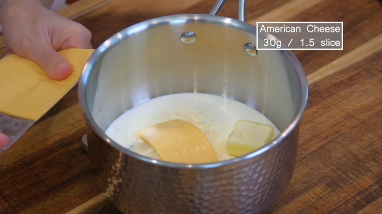 Image of Meanwhile, combine the unsalted butter, whipping cream, gelatin powder, sugar, milk powder, and American cheese in a saucepan. Although cheese is not a traditional Chinese ingredient, nowadays, mooncake has developed many new fillings with all kinds of flavors and using...