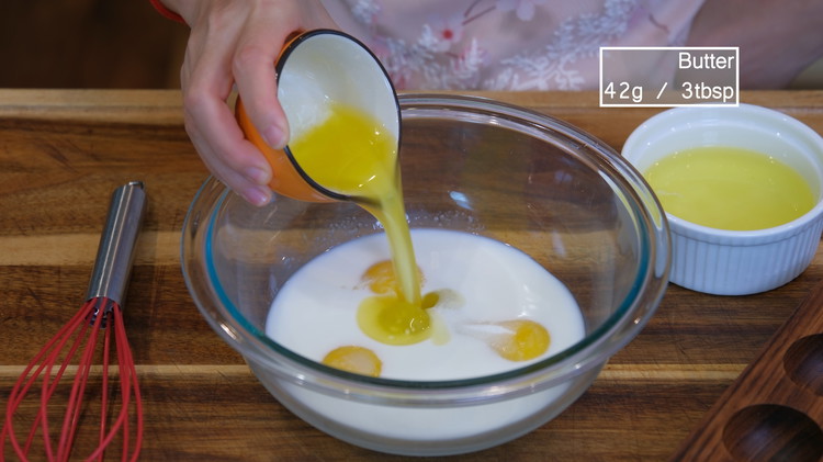 Image of In a mixing bowl, combine the egg yolks, sugar, milk, and melted butter. Make sure the milk is warm; otherwise, the butter will clump up. The milk yolk custard filling requires three egg yolks; if you don't know what to...