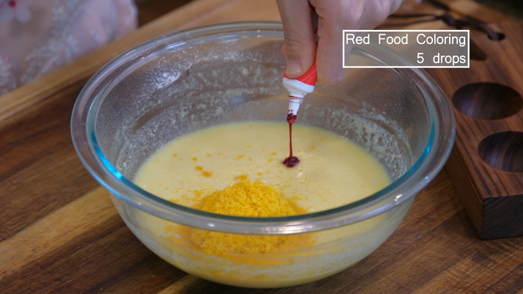 Image of Optionally, add some red food coloring. The lava center and the custard filling share a similar color. The food coloring will give some separation to different layers so the presentation looks nicer.