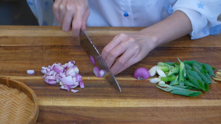 Image of Slice 1 inch of ginger thinly; slice 2 scallions diagonally into 1/2 inch pieces; Quarter 2 shallots; peel the outer layers; then slice them thinly.