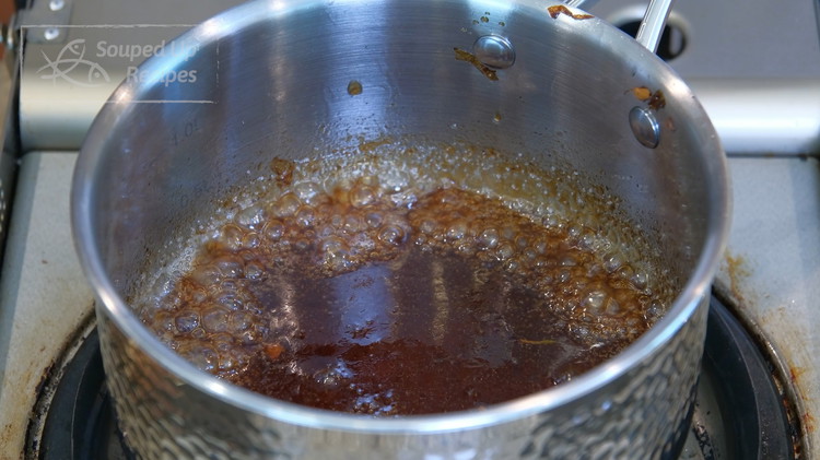 Image of Add the oil back to the pan long with soy sauce, oyster sauce, and sugar. Mix over low heat until the seasoning is condensed. Turn off the heat and set the sauce aside.