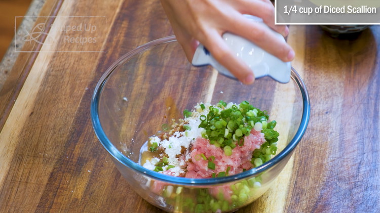 Image of Season the ground pork with salt, soy sauce, dark soy sauce, oyster sauce, sugar, cornstarch, minced garlic, minced ginger, Chinese cooking wine, and diced scallion.