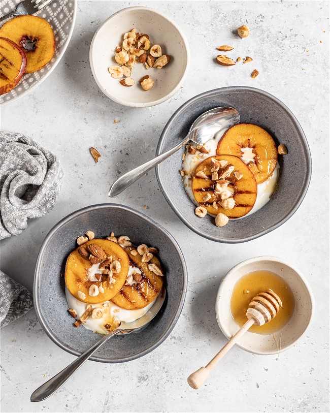 Image of Yoghurt Bowl with Griddled Peaches & Roasted Nuts