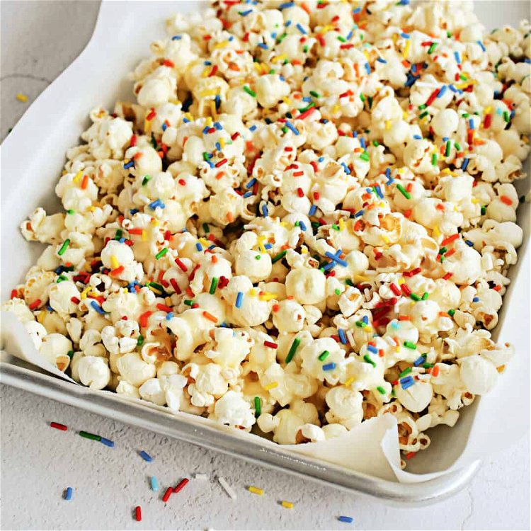 Image of Spread the coated popcorn on a sheet pan lined with...