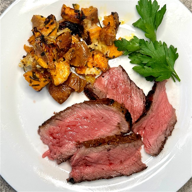 Image of tomahawk steak on the  grill