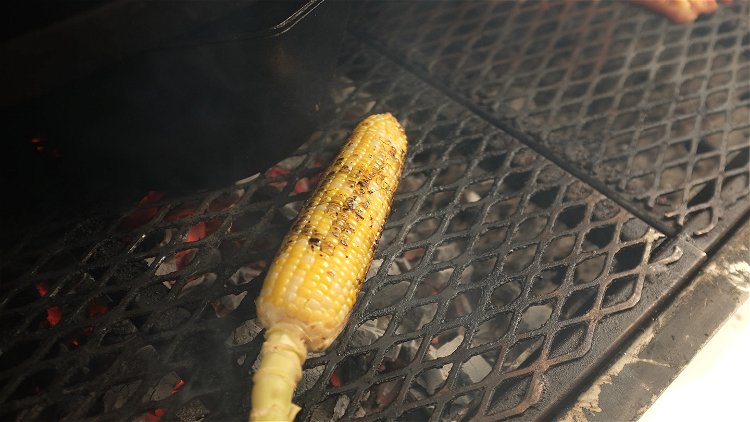 Image of Grill the corn directly over coals until lightly charred on...