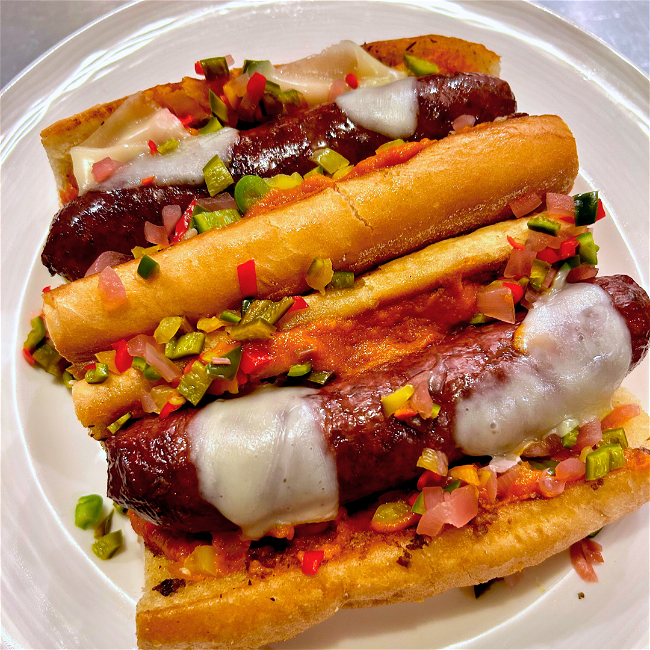 Bison brats with cheese on bun