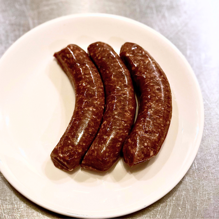 Image of Skewer your brats to keep them straight as they cook. The natural casing will pull in to a curl as it cooks without the skewers.