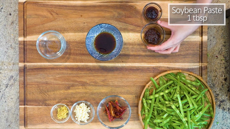 Image of In a sauce bowl, combine the soy sauce, soybean paste, oyster sauce, and water.