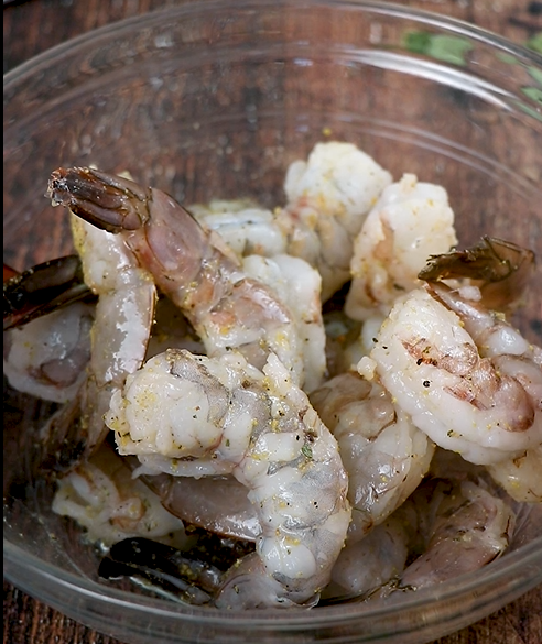 Image of Toss your thawed Sizzlefish shrimp in a seafood seasoning mix.