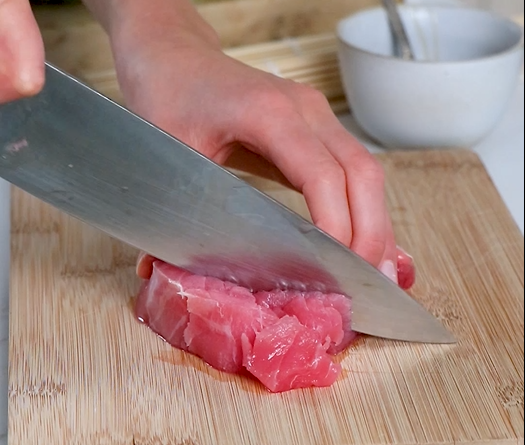 Image of Slice the thawed ahi tuna against the grain into tiny...