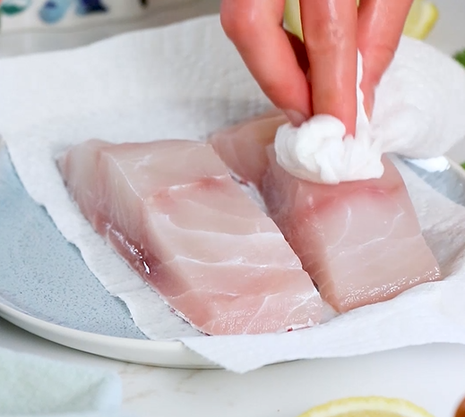 Image of Place the thawed Red Snapper fillets on a plate. Pat...