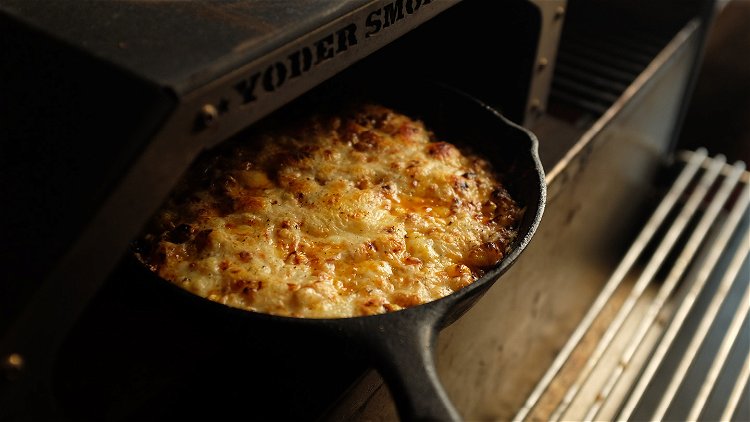 Image of Top with the grated mozzarella. Slide the skillet inside the...
