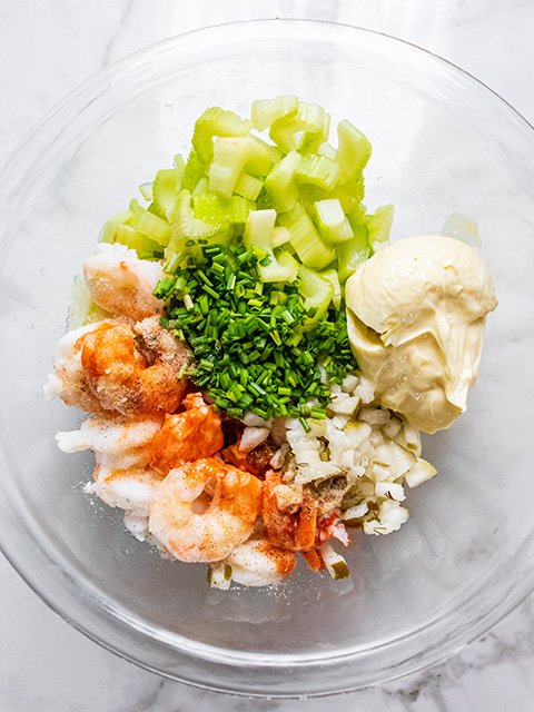 Image of Combine chilled shrimp, celery, pickles, 1 tablespoon of chives, mayonnaise,...