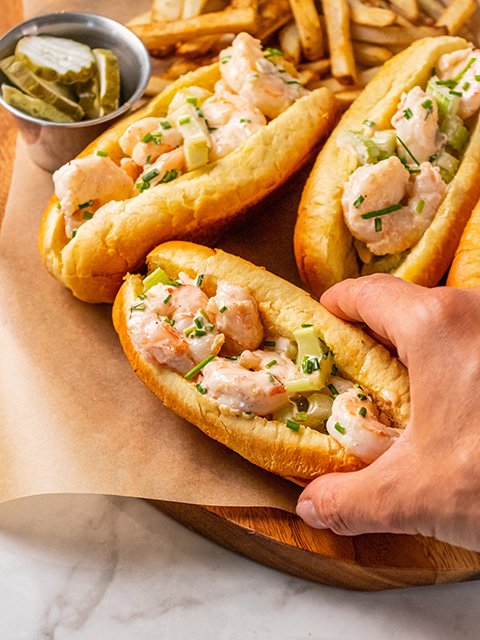 Image of Spoon shrimp mixture into toasted buns and top with additional...