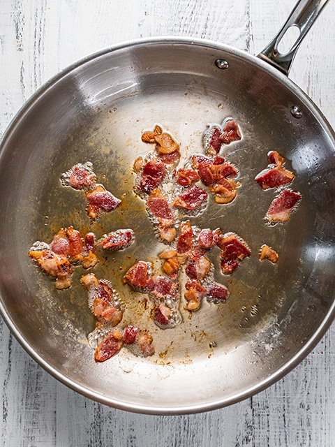 Image of While grits cook, heat bacon in a large skillet over...