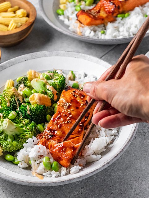 Image of Serve salmon over rice with vegetables topped with sriracha mayonnaise...